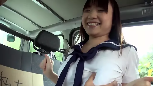 Japanese college girl with big tits gives blowjob in the car