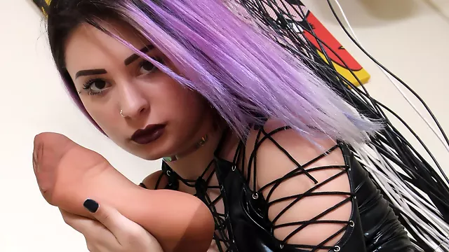 Super-hot Violet in a black leather fetish dress flaunts her nyloned feet in a tempting way