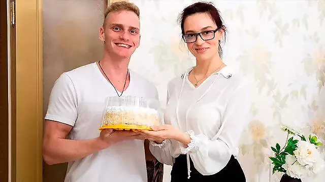 A cake with whipped cream and a huge cock