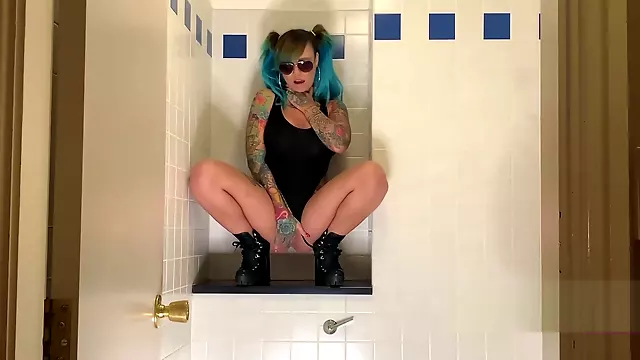 Ms Hayley B masturbating in a hotel bathroom she Squirts everywhere then licks her fingers