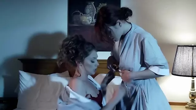 Lesbian housekeepers enjoy each other's pussy in a hotel room