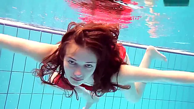 Red Dressed teen 18 Swimming With Her Eyes Opened