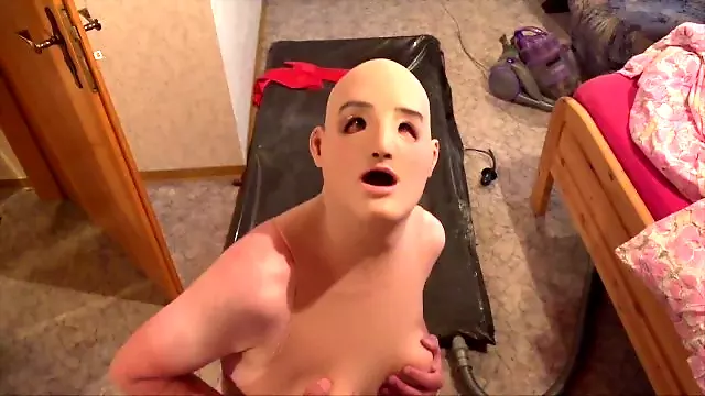 Silicone doll poses near vacbed